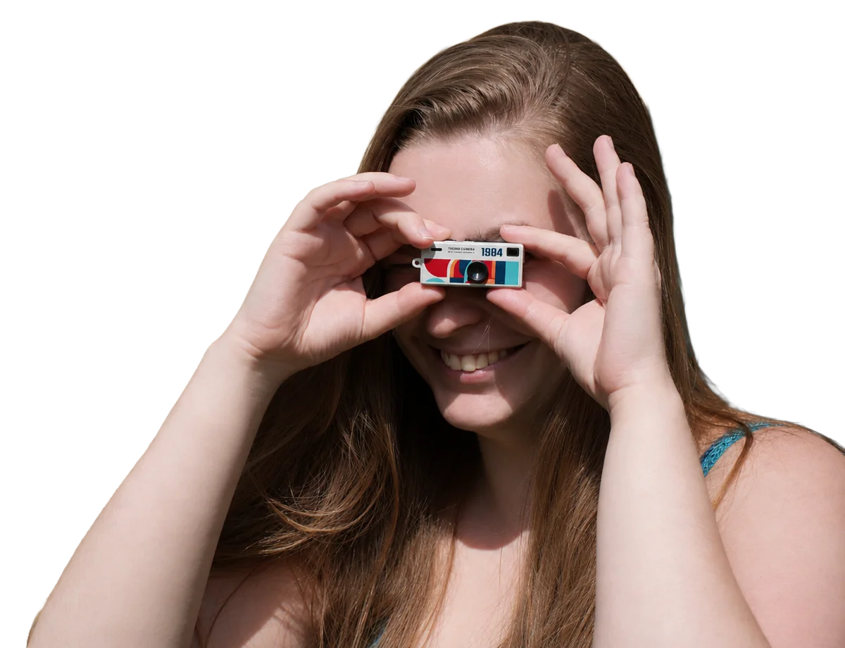 Person using a ShutterShare mini camera at an event